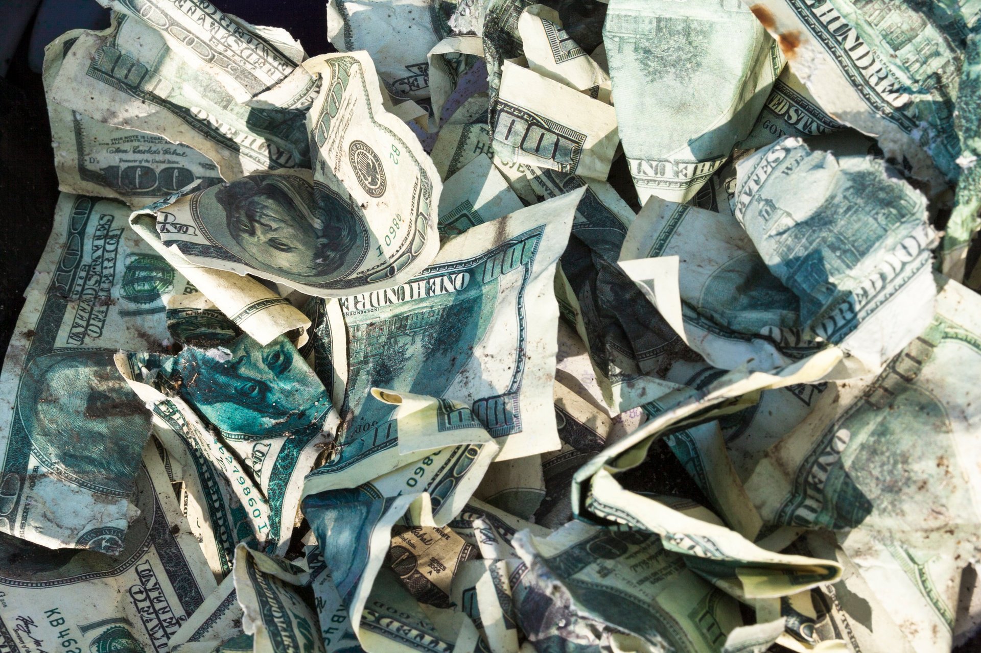 Pile of crumpled one hundred-dollar bills